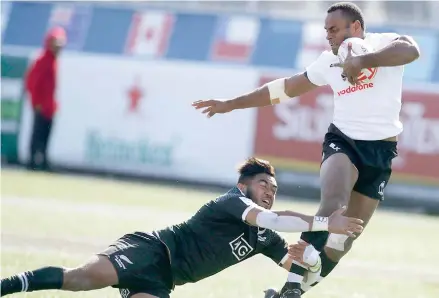  ?? Photo: Zimbio ?? Vodafone Fijian 7s rover Joeli Lutumailag­i is taken in tackle by Vilimoni Koroi of New Zealand in the USA 7s in Las Vegas on Monday.