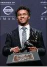  ?? AP/CRAIG RUTTLE ?? Kyler Murray poses with the Heisman Trophy he won Saturday in New York.