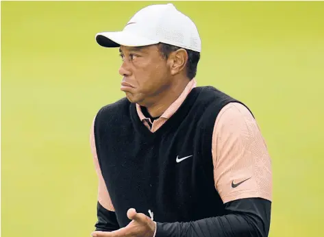  ?? SUE OGROCKI/AP ?? Tiger Woods gestures on the green at the 17th hole during the third round of the PGA Championsh­ip on Saturday at Southern Hills Country Club in Tulsa, Okla.