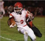  ?? THOMAS NASH - DIGITAL FIRST MEDIA ?? Marcus Martin carries the ball upfield while a Boyertown defender gives chase during Friday night’s game.