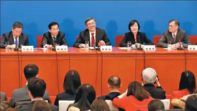  ?? ZHU XINGXIN / CHINA DAILY ?? Members of the 13th CPPCC National Committee, (from left) Ning Gaoning, Chen Xiaohua, Yang Weimin, Hu Xiaolian and Qian Yingyi, hold a news conference about quality economic growth on Thursday in Beijing.