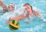  ?? RECORDER PHOTO BY CHIEKO HARA ?? Portervill­e High School’s Rosemary Chapman, right, reaches out for a ball over Monache High School’s Ava Lobue Wednesday, Oct. 24, during the first half of a game at Portervill­e High School.