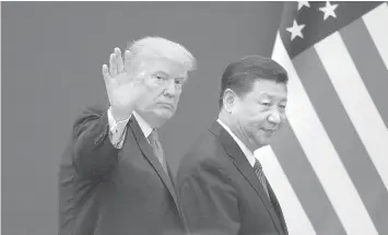  ??  ?? US President Donald Trump (L) and China's President Xi Jinping leaving a business leaders event at the Great Hall of the People in Beijing. President Xi Jinping's leap toward lifelong rule has largely been met by guarded silence in world capitals as government­s try to predict how China's formidable leader will wield his newfound power on the global stage.