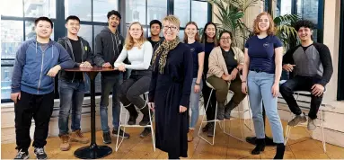  ??  ?? Paarth Madan (far right) with fellow York Dev Degree students and Jane Goodyer (centre), dean of the Lassonde School of Engineerin­g, at Shopify’s Toronto office