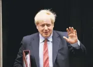  ?? Matt Dunham / Associated Press ?? British Prime Minister Boris Johnson leaves number 10 Downing Street, to attend Prime Minister's Questions at the Houses of Parliament in London on July 8.