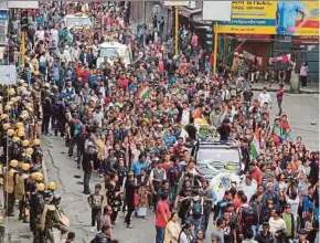  ?? REUTERS PIC ?? Supporters of the Gorkha Janmukti Morcha (GJM) separatist movement parading the bodies of protesters who were killed in clashes with security forces in Darjeeling on Saturday.