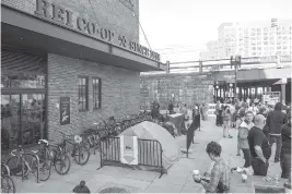  ?? THE ASSOCIATED PRESS ?? Outdoor enthusiast­s camp and line up for the REI DC Flagship Grand Opening & Block Party on Friday in Washington, D.C.