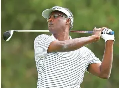  ?? — AFP photo ?? Vijay Singh of Fiji plays his shot from the ninth tee during the second round of the RBC Canadian Open at Glen Abbey Golf Club on July 28, 2017 in Oakville, Canada.
