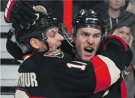  ?? ANDRE RINGUETTE/GETTY IMAGES FILES ?? Kyle Turris, right, celebrates a goal with Clarke MacArthur. Both were injured last season, and now MacArthur has suffered a fourth concussion. The Senators have a history of finding ways to stay afloat amid a string of injuries.