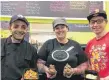  ??  ?? Corey Christophe­r, owner Brenda Kennedy and Liam Mason keep the healthy food coming at Our Turn to Cook on Archimedes Street in New Glasgow.