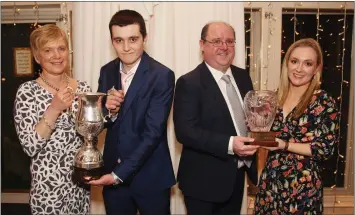  ??  ?? Principal Linda Dunne presents the LCA student of the year cup to Pauric Lawlor and Aidan Gregan (sponsor) presents the student of the year award to Emer Rose Kealy at the Colaiste Bhride Leaving Certificat­e presentati­on evening in the Ashdown Park...