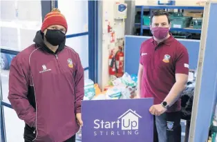  ??  ?? Deliver-two Director of rugby Jimmy Samuel and club captain Kevin Mccormack dropping off the club’s can drive at Start Up Stirling