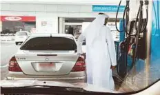 ?? Abdul Rahman/Gulf News ?? A motorist refuels at a self-service Adnoc station in Abu Dhabi yesterday.