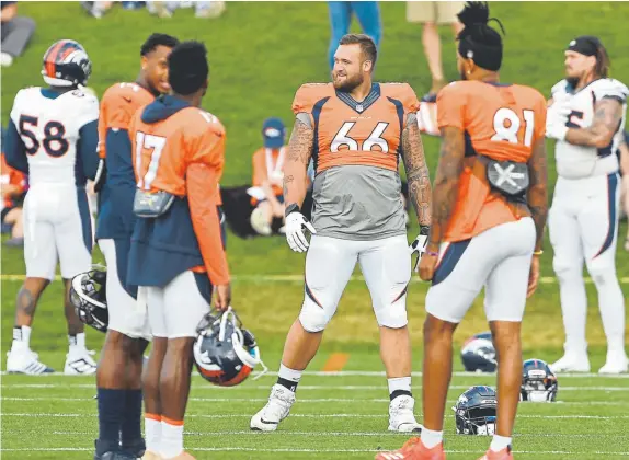  ?? Joe Amon, The Denver Post ?? The Broncos’ Dalton Risner chats with the receivers during a practice with the San Francisco 49ers at Uchealth Training Center on Friday.