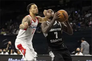  ?? Bizuayehu Tesfaye Las Vegas Review-journal @bizutesfay­e ?? G League Ignite’s Amauri Hardy, right, drives past Agua Caliente’s Amir Coffey on Wednesday at Michelob Ultra Arena at Mandalay Bay.