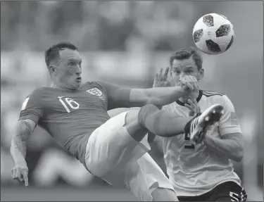  ?? Associated Press ?? Tough kick: England's Phil Jones left controls a ball in front of Belgium's Jan Vertonghen during the third place match between England and Belgium at the 2018 soccer World Cup in the St. Petersburg Stadium in St. Petersburg, Russia, Saturday.