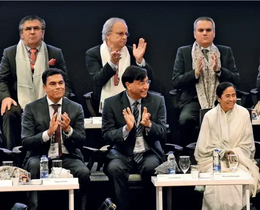  ?? DEBAJYOTI CHAKRABORT­Y/GETTY IMAGES ?? IN BUSINESS West Bengal chief minister Mamata Banerjee with industrial­ists (L-R) Sajjan Jindal, Lakshmi Mittal and Mukesh Ambani and state fina