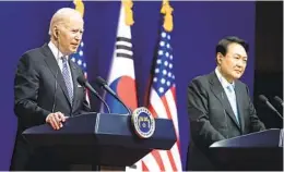  ?? EVAN VUCCI AP ?? President Joe Biden (left) speaks alongside South Korean President Yoon Suk Yeol at the Ministry of National Defense on Saturday in Seoul, South Korea.