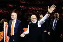  ?? ?? Indian Prime Minister Narendra Modi (right) and Australia’s Prime Minister Anthony Albanese at the Qudos Arena in Sydney on Tuesday. — afp