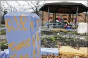  ?? ASSOCIATED PRESS 2015 ?? “R.I.P. Tamir Rice” is written on a wooden post near a makeshift memorial at the gazebo where the boy was fatally shot outside the Cudell Recreation Center in Cleveland. Rice, 12, was shot by a white Cleveland police officer on Nov. 22, 2014.