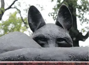  ??  ?? A bronze coyote sits atop Mary Anne Barkhouse’s Reign in ᐄᓃᐤ (ÎNÎW) River Lot 11∞ — Edmonton’s brand-new Indigenous art park.