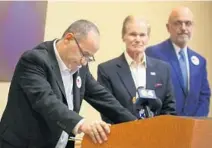  ?? CARLINE JEAN/SUN SENTINEL ?? Fred Guttenberg, father of a student slain in the Parkland school shooting, speaks about her Friday as he endorses U.S. Sen. Bill Nelson, center.