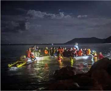  ??  ?? Migrants off Greece in 2015: ‘Nobody puts their children in a dinghy if they don’t have a reason’