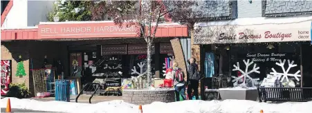  ?? DARREN STONE, TIMES COLONIST ?? Fake snow and decoration­s festoon Beacon Avenue in October for filming of the Hallmark movie Christmas Bells Are Ringing. It is scheduled to air on Dec. 23. A Christmas market scene was filmed on Sidney Pier.