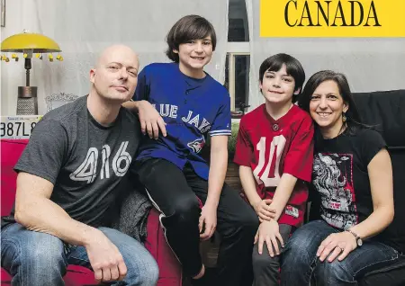  ?? CHRISTOPHE­R KATSAROV FOR NATIONAL POST ?? Mark Wilkins with his wife Donna Wilkins and their children Aidan and Devin in their Toronto home. Disenchant­ed with life in the U.S., the familymigr­ated to Canada in 2013, something many Americans appear to be considerin­g in light of an increasing­ly inflammato­ry political discourse.