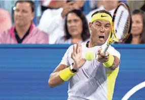  ?? ALBERT CESARE/USA TODAY NETWORK ?? Rafael Nadal hits a return to Borna Coric during the third set of their match in the 2022 Western & Southern Open.