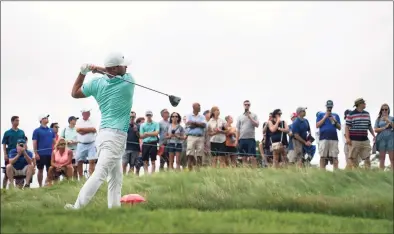  ?? John Minchillo / Associated Press ?? Brooks Koepka watches his shot from the third tee during the third round of the Travelers Championsh­ip on Saturday in Cromwell.