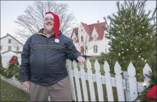  ?? Stephen Flemming, executive director of the historic village, says workers and volunteers began the holiday conversion six weeks ago. He estimated it has taken about 7,200 hours for the full transforma­tion to winter wonderland. ??