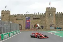  ?? Mdzinarish­vili — REUTERS/David ?? IN ACTION: Ferrari’s Sebastian Vettell during practice.