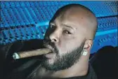  ?? Ken Hively Los Angeles Times ?? IN THE West Coast rap scene, Marion “Suge” Knight was an imposing figure — a swaggering record producer with a cigar and diamonds.