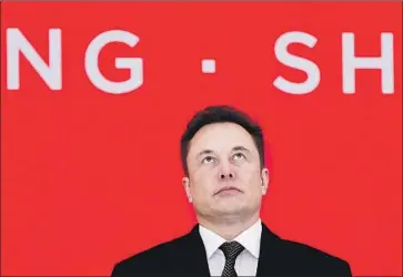  ?? Xinhua/Zuma Press via TNS ?? TESLA CEO Elon Musk has said nothing about the current level of production in Shanghai. The company has lost money every year since it went public in 2010. Above, Musk at an event in Shanghai last year.