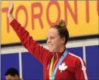  ?? The Canadian Press ?? Kierra Smith celebrates her gold medal in the women’s 200-metre breaststro­ke at the 2015 Pan Am Games in Toronto.