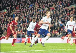  ??  ?? Tottenham Hotspur's English striker Harry Kane (C) celebrates after scoring his team's second goal against Liverpool during the English Premier League football match at Anfield in Liverpool.