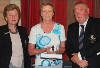  ??  ?? Laytown & Bettystown Golf Club President Tom Ryan presents scratch player Carol Wickham with her prize as winner of the President’s Prize to the Ladies after she returned a superb score of 70.