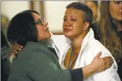  ??  ?? City staffers embrace, above, in the hallways of San Francisco City Hall on Tuesday after hearing the news of the death of Mayor Edwin Lee, left.