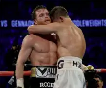 ??  ?? CHAPTER CLOSED: After a bitter build up Canelo and Golovkin embrace