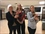  ?? ALEXIS OATMAN — THE NEWS-HERALD ?? Three residents of Kirtland Rehab Center are shown having some puppy time.
Jenny Calkins, left, Kristi Lockwood and Victoria Plotner are shown with the two fostered hound-dog puppies.