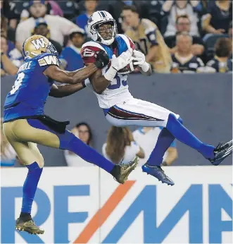  ?? JOHN WOODS/THE CANADIAN PRESS ?? Winnipeg cornerback Chris Randle, left, seen defending against Duron Carter of the Alouettes during a recent game, expects to be tested when he faces his former team on Thursday.
