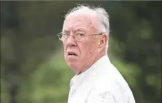  ?? Antonella Crescimben­i/Post-Gazette ?? The Rev. John Sweeney, of Greensburg, waits for his attorney after his arraignmen­t July 24, 2017. He pleaded guilty Monday to indecent assault on a minor under 14 years old.