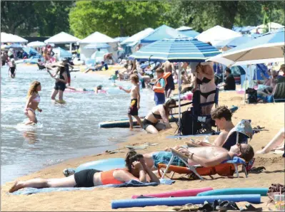  ?? MARK BRETT/Local Journalism Initiative ?? People try to beat the heat in Okanagan Lake at Penticton.