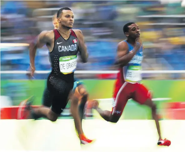  ?? — JEAN LEVAC ?? Andre De Grasse races in his 200-metre heat on Tuesday at the Rio Olympics. The Canadian had the fastest qualifying time.