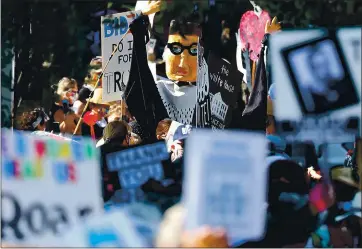  ?? SHMUEL THALER — SANTA CRUZ SENTINEL ?? A far larger-than-life puppet of the late Supreme Court Justice Ruth Bader Ginsburg makes its way along Water Street as hundreds of Santa Cruzans join with thousands across the country for Women’s March 2020 on Saturday.