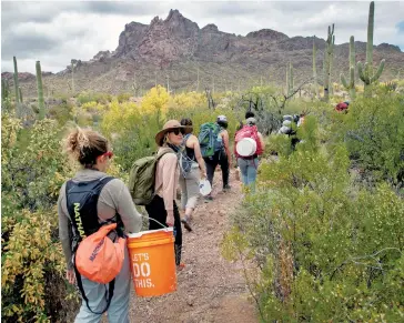  ??  ?? Volunteers bring aid to undocument­ed immigrants in Arizona: true compassion involves action