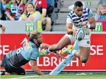  ??  ?? Up in the air: Marland Yarde (top) dives for the line for a one-handed try while Joe Cokanasiga evades Luke Wallace