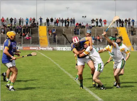  ?? Photo by Domnick Walsh / Eye Focus ?? Lixnaw’s Jeremy McKenna and Kilmoyley’s Paudi O’Connor define what tight marking means, in the Kilmoyley v Lixnaw game in the Austin Stacks Park on Sunday last in the Garvey Supervalu Hurling Championsh­ip quarter finals