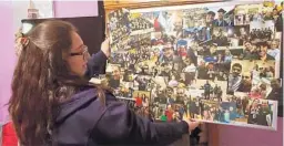  ?? FAMILY PHOTOS ?? Jasmin Sosa, Juan Carlos Sosa’s daughter, holds a collage of photos of her father and the community he served. Sosa worked as a custodian at a school in Celebratio­n.